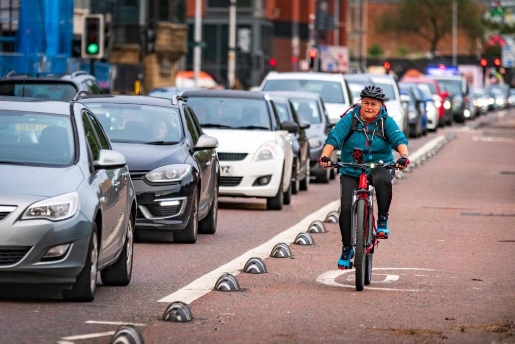woman commuting in a cycle lane