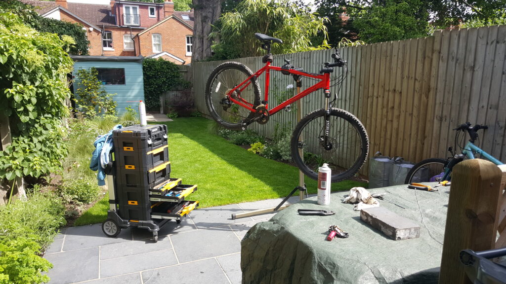 Bike on a stand being repaired in garden